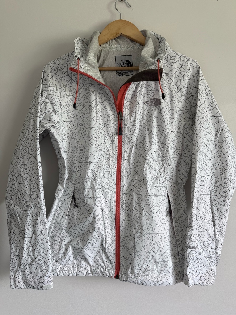 The North Face HyVent 2.5L White Geometric Rain Shell with Bright Orange Accents